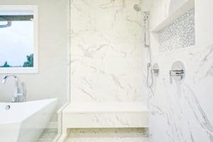 bathroom with frameless glass shower doors